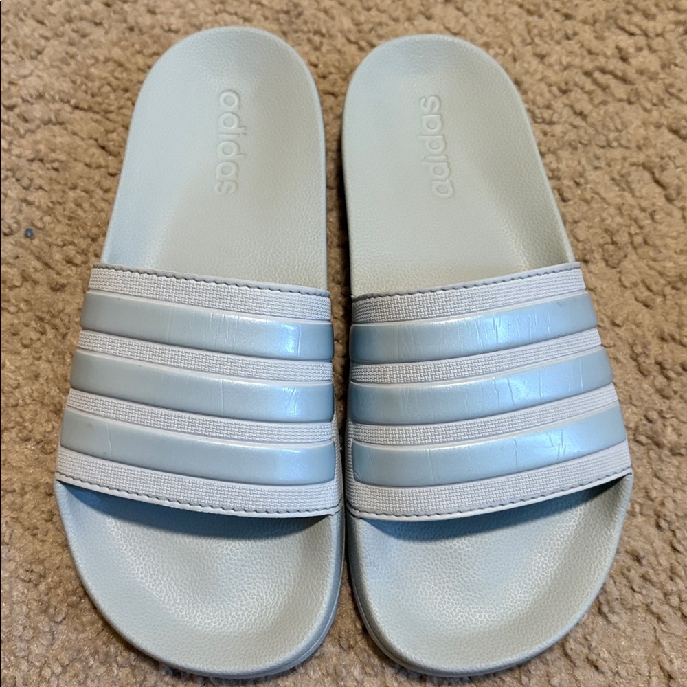 Light blue adidas slides